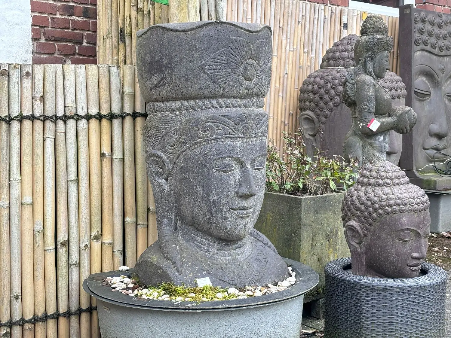 Product image 2 of the product “Javanese Ken Dedes head with a pot on it, can be used as planter. 54 x 54 x 101cm. Stone cast, handcrafted & coloured ”